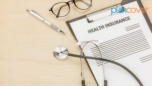 top view health insurance form eyeglasses with stethoscope wooden background business healthcare concept savings flat lay copy space
